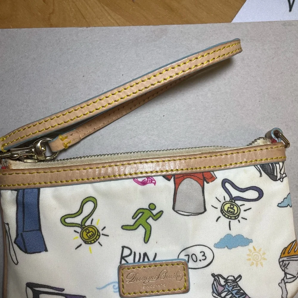 Dooney & Bourke Disney Sketch Marathon Wristlet 70.3 Run is a small wristlet